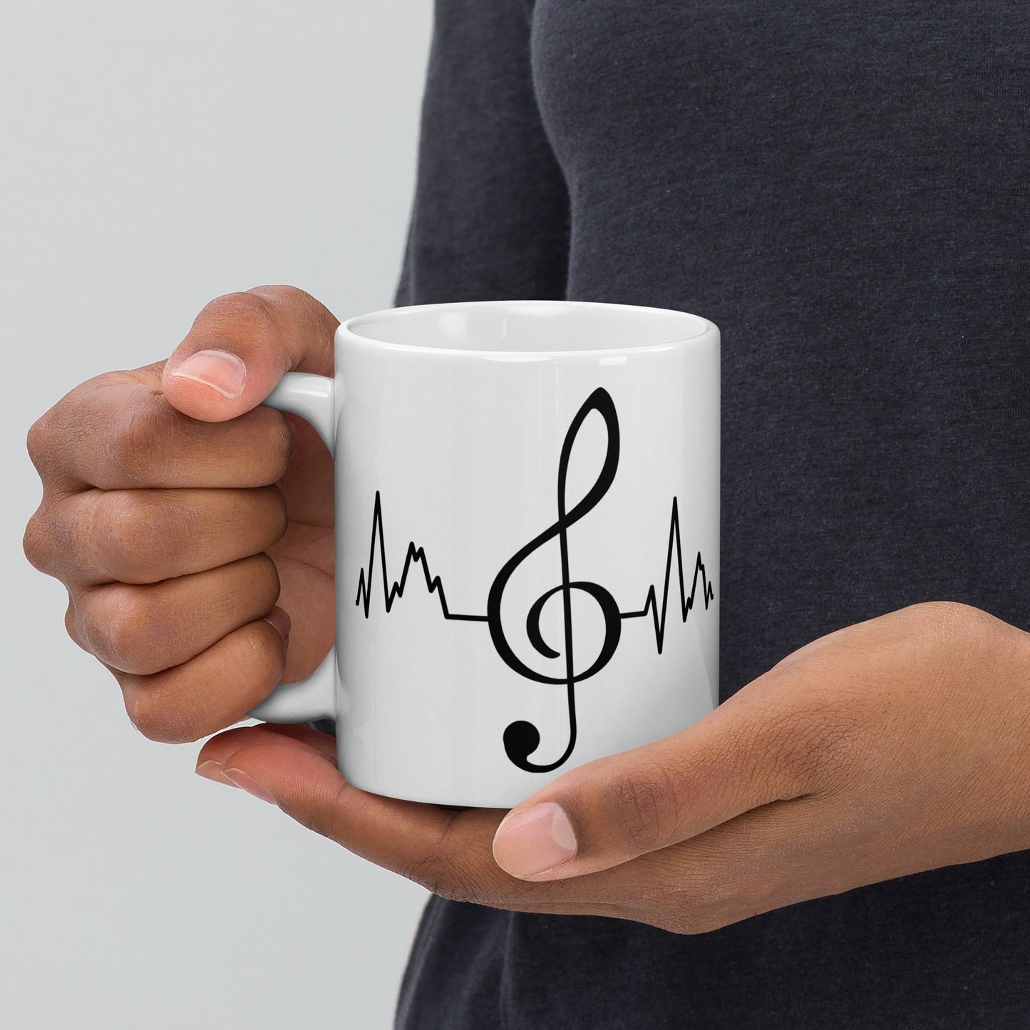Taza con latidos de clave de sol