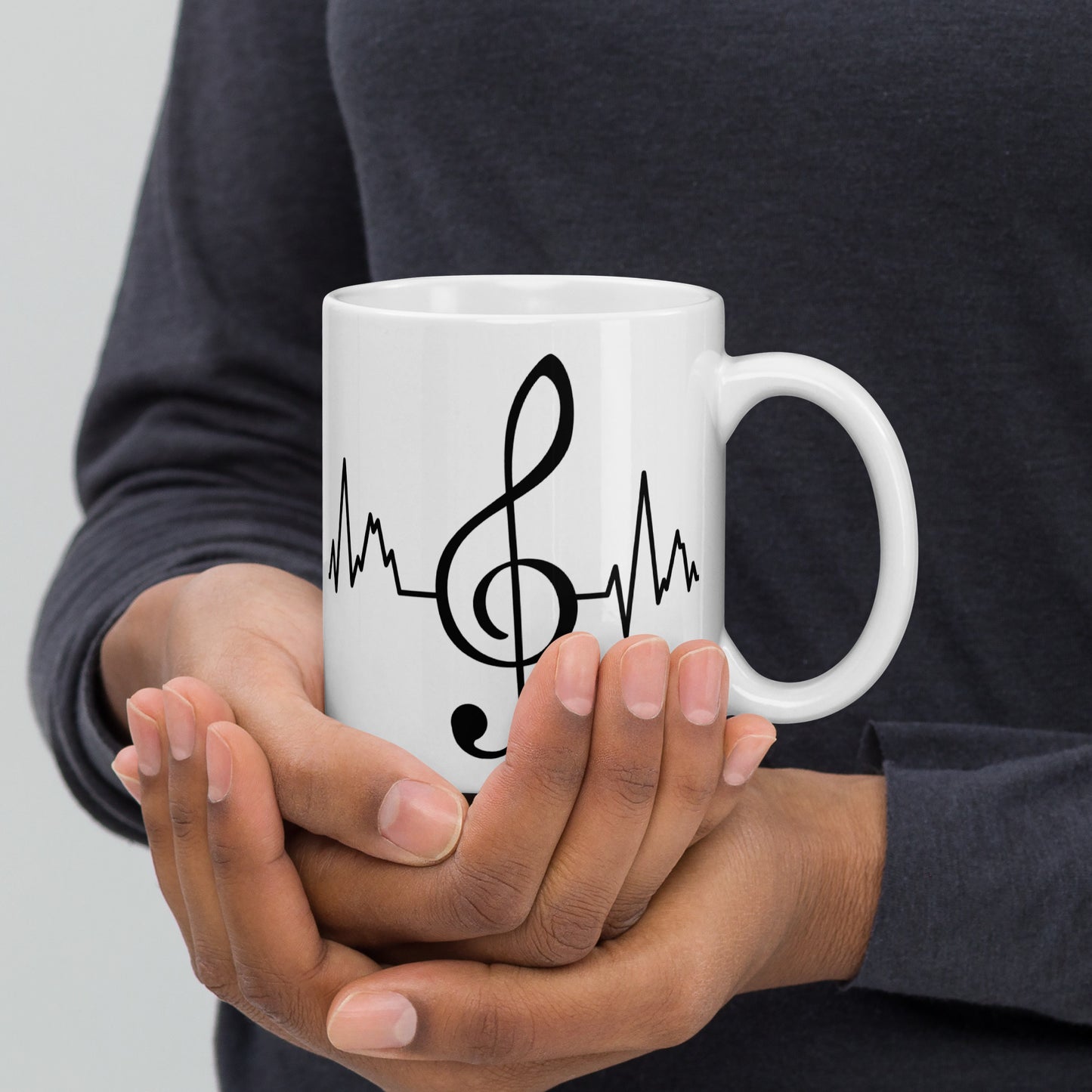 Taza con latidos de clave de sol