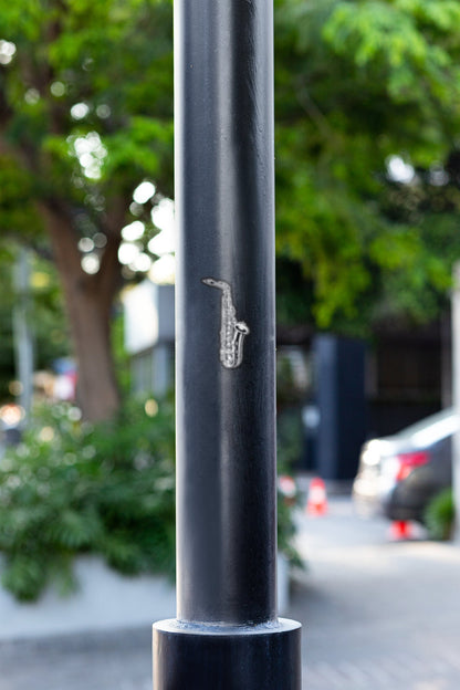 a close up of a pole with a musical instrument on it