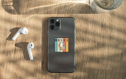 an iphone, ear buds, and headphones on a table
