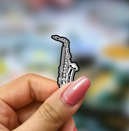 a person holding a small metal object in their hand
