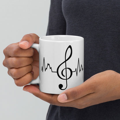 Taza con latidos de clave de sol