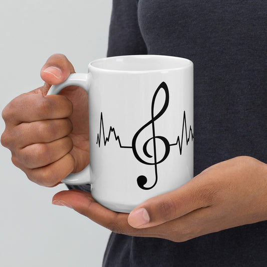 Taza con latidos de clave de sol